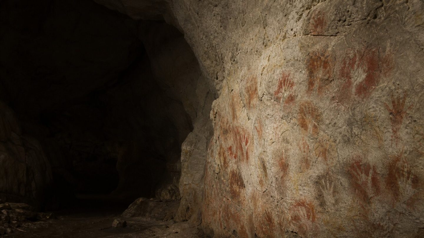 Prehistoric hand stencils on a cave wall