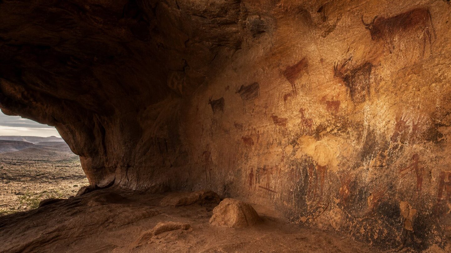 Painted rock shelter with ochre figures